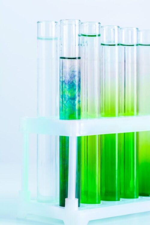 green-liquids-in-test-tubes-in-chemical-laboratory-close-up